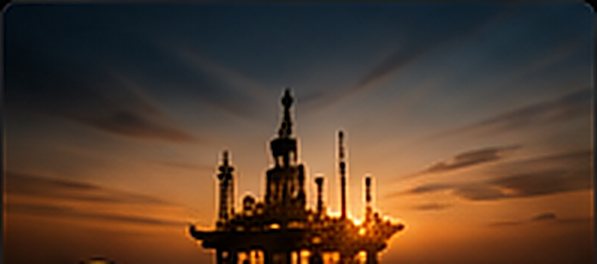 An offshore crude production platform at dusk